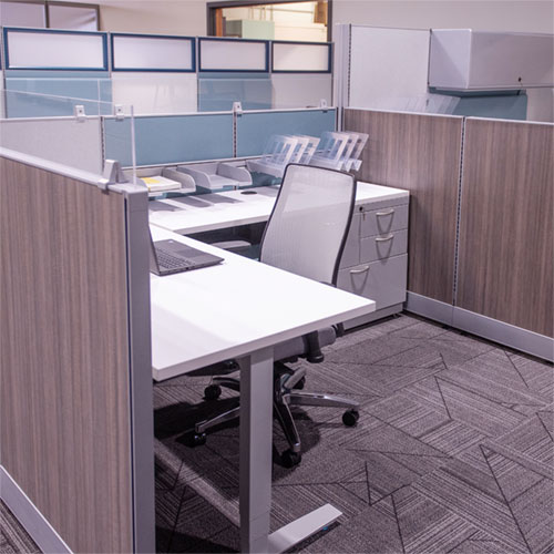 Kentwood Office Furniture EKOS workstation with laminate panels and height-adjustable surface