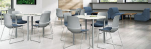 Workplace cafe with round tables and wire frame chairs